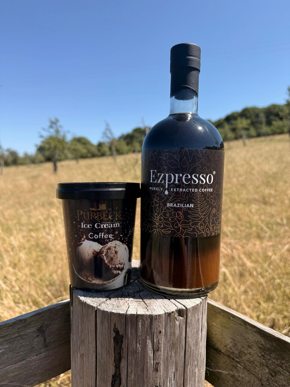 Purbeck Ice Cream 500ml tub next to Ezpresso coffee bottle in the countryside.